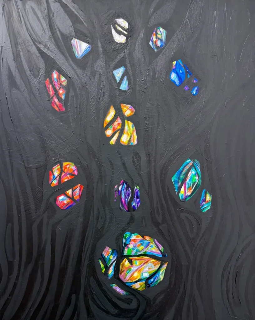 Colorful stained glass shapes on a dark textured background.